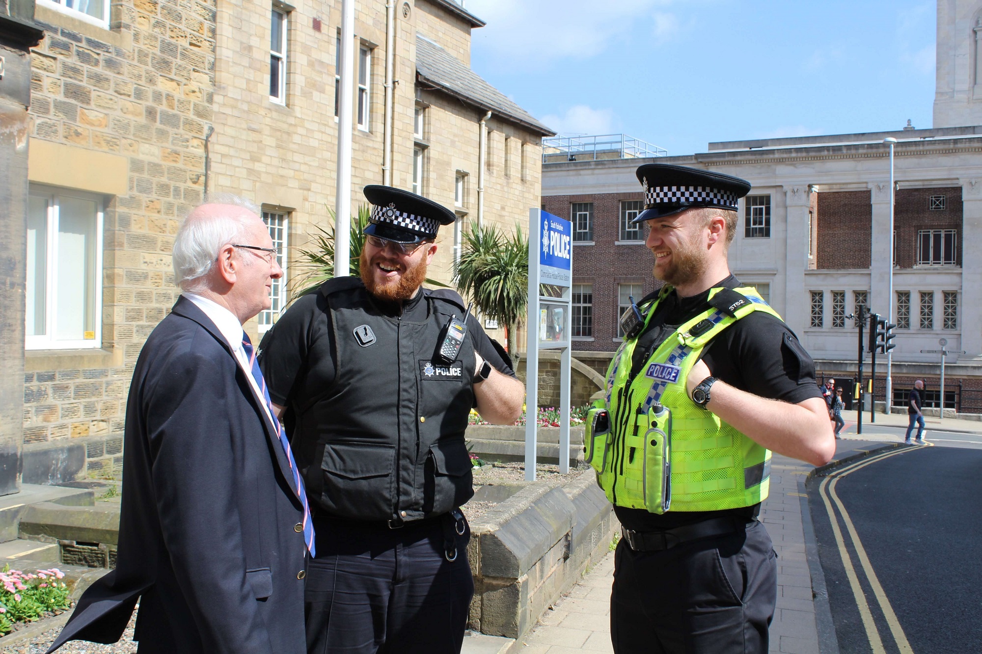 Dr Alan Billings speaks with two police officers