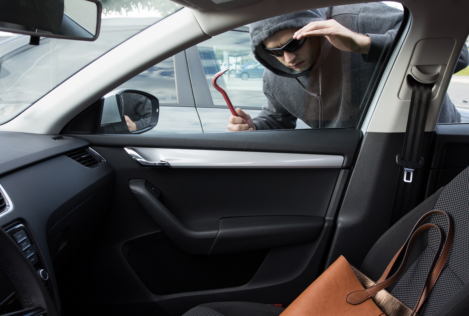 Stock photo for vehicle crime - handbag on front seat of car
