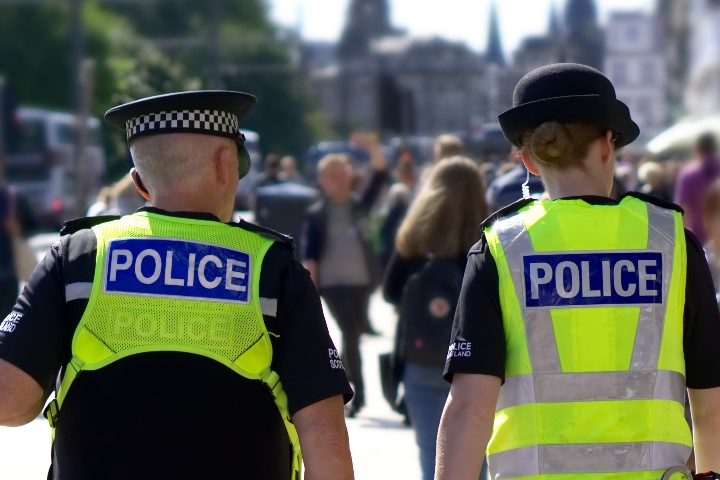 Police walking through a city centre